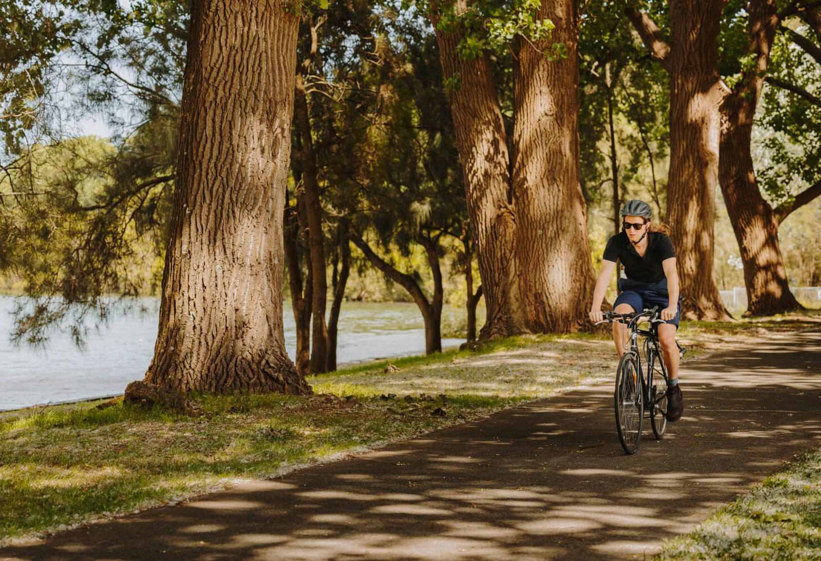 Cyclist riding by water